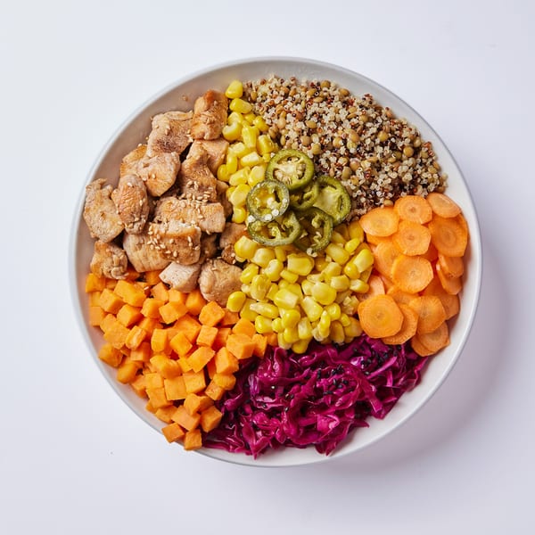 Inti Poke bowl with chicken, quinoa, corn, jalapenos, carrots, sweet potatoes, and red cabbage.