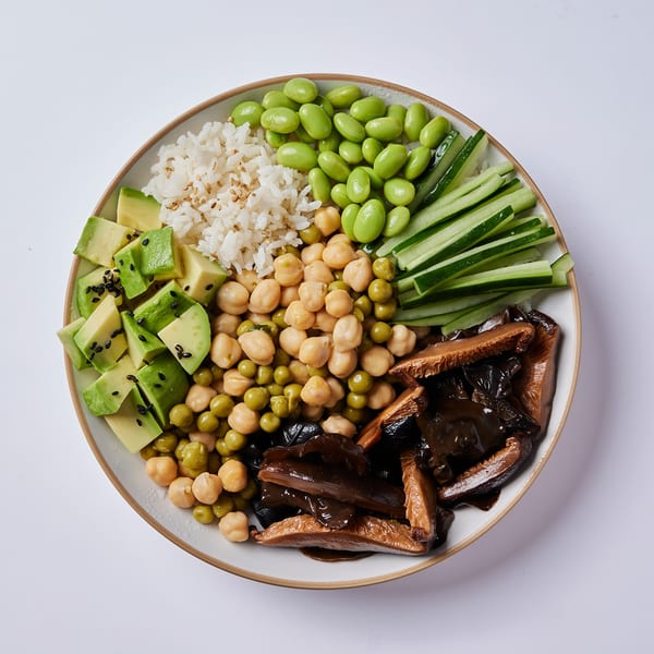 Inti Poke vegan poke bowl with rice, edamame, avocado, chickpeas, peas, cucumber, and mushrooms.